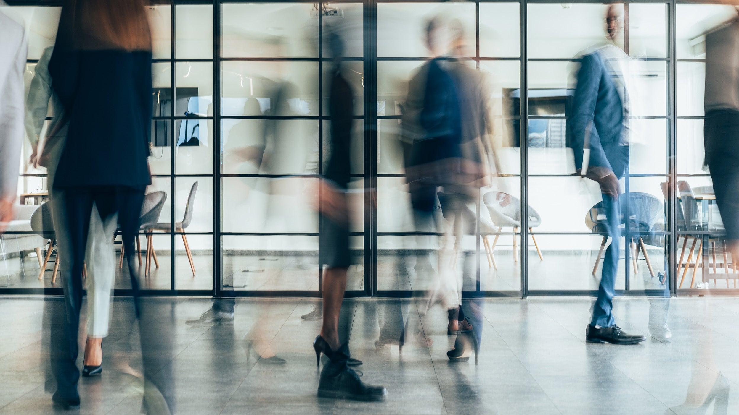 blurry image of people walking 