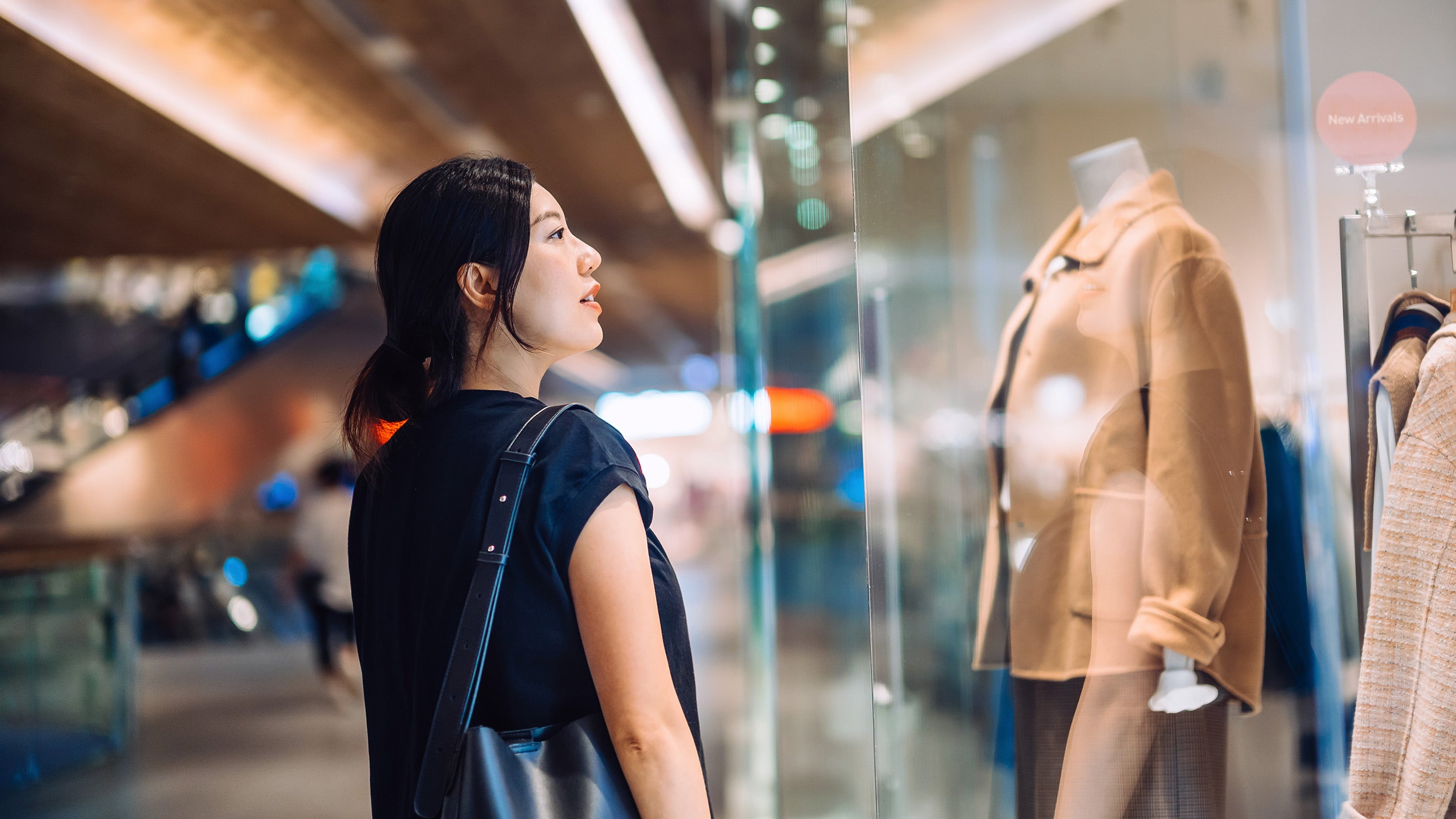 Woman looking in shop window