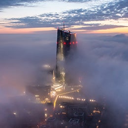 A%20sunrise%20in%20Frankfurt.%20The%20European%20Central%20Bank%20building%20sticking%20out%20of%20the%20fog%20while%20the%20sun%20is%20rising.