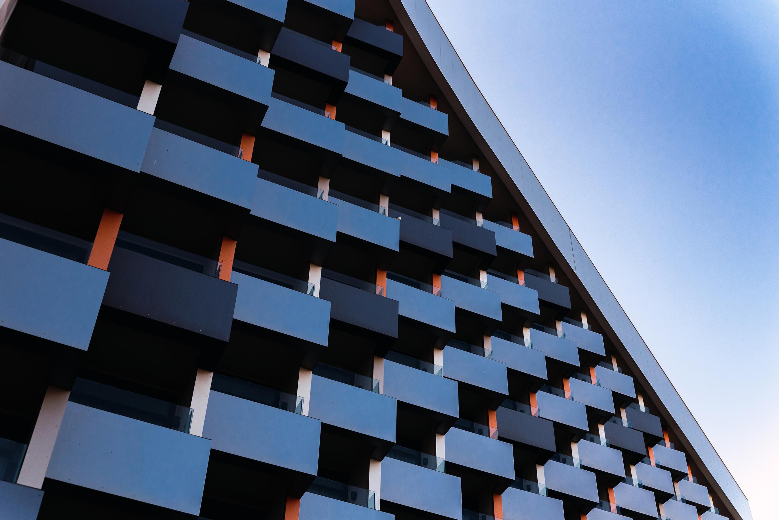 Modern building with square balconies seen from below. Modern architecture.