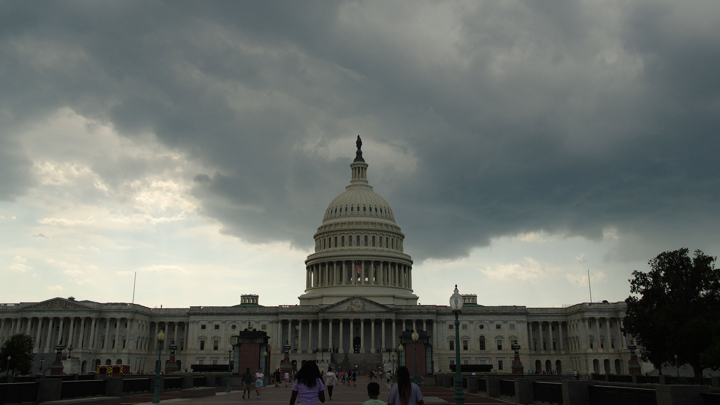 An approaching thunderstorm brings dark clouds to the U.S. Capitol in Washington, DC.