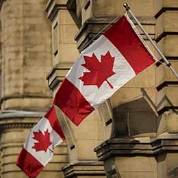 A%20photo%20of%20the%20Canadian%20flag%20waving%20from%20a%20building.