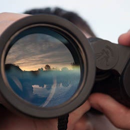 Man%20looking%20through%20binoculars