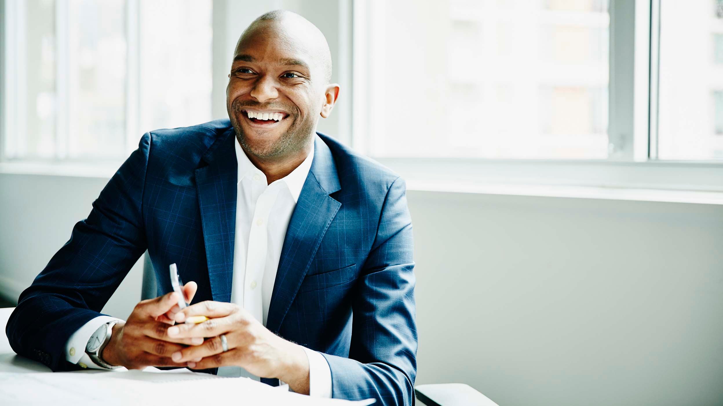 An image of a Black businessman representing the diversity requirement of company board members for inclusion in the Nasdaq Eschange.