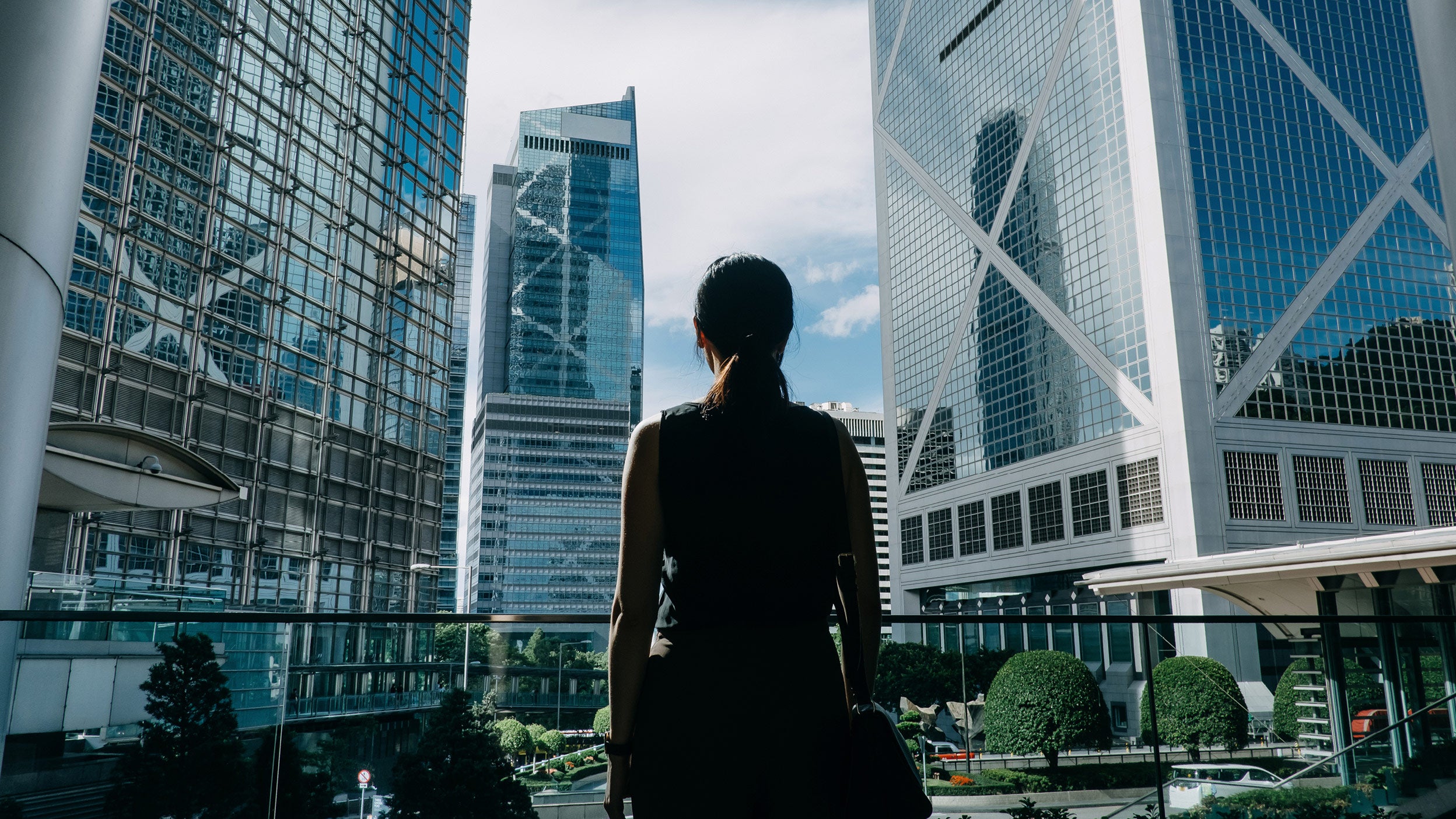 Woman looking at skyscrapers