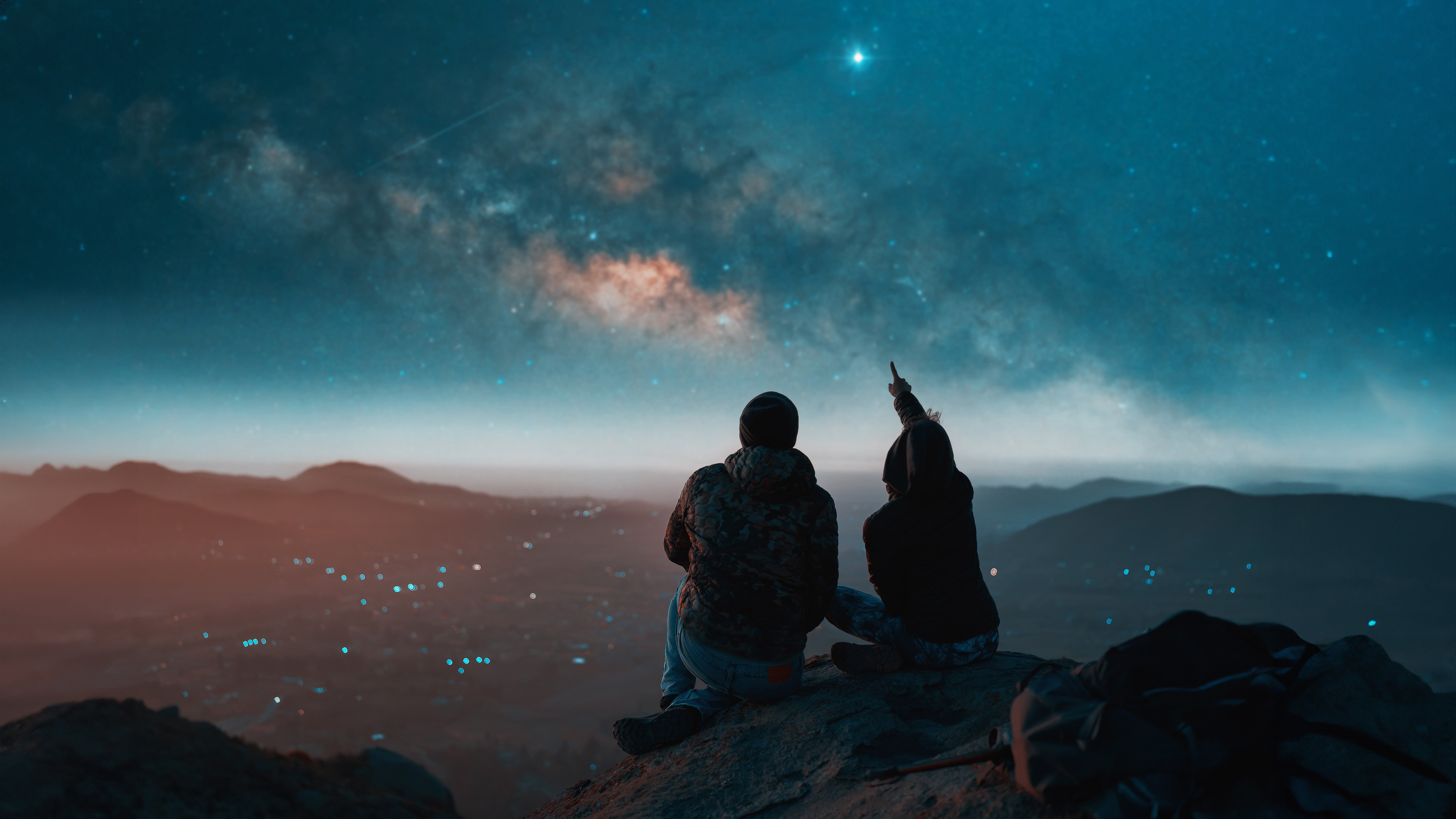 Two people stargazing