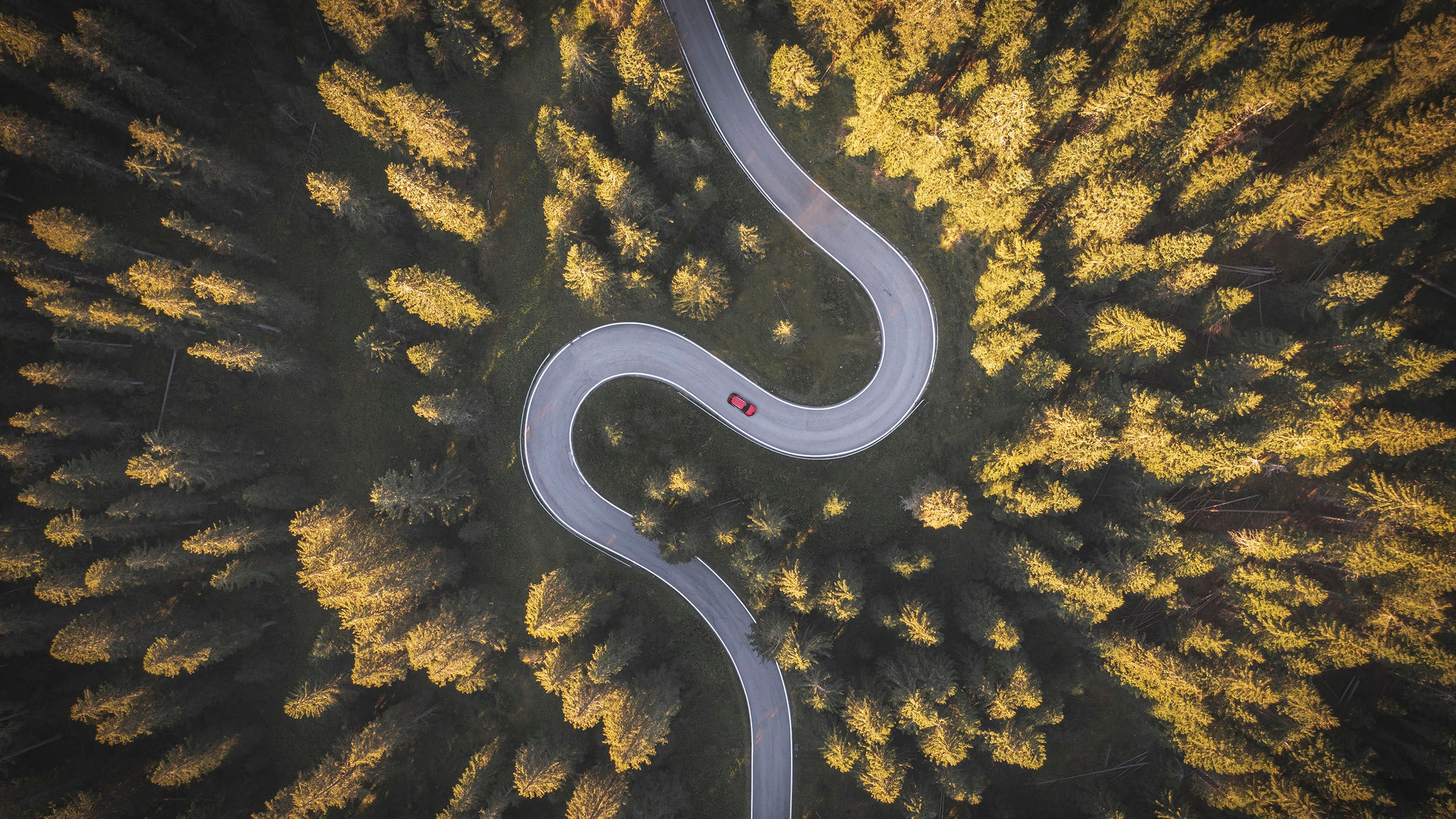 Car driving on winding mountain road