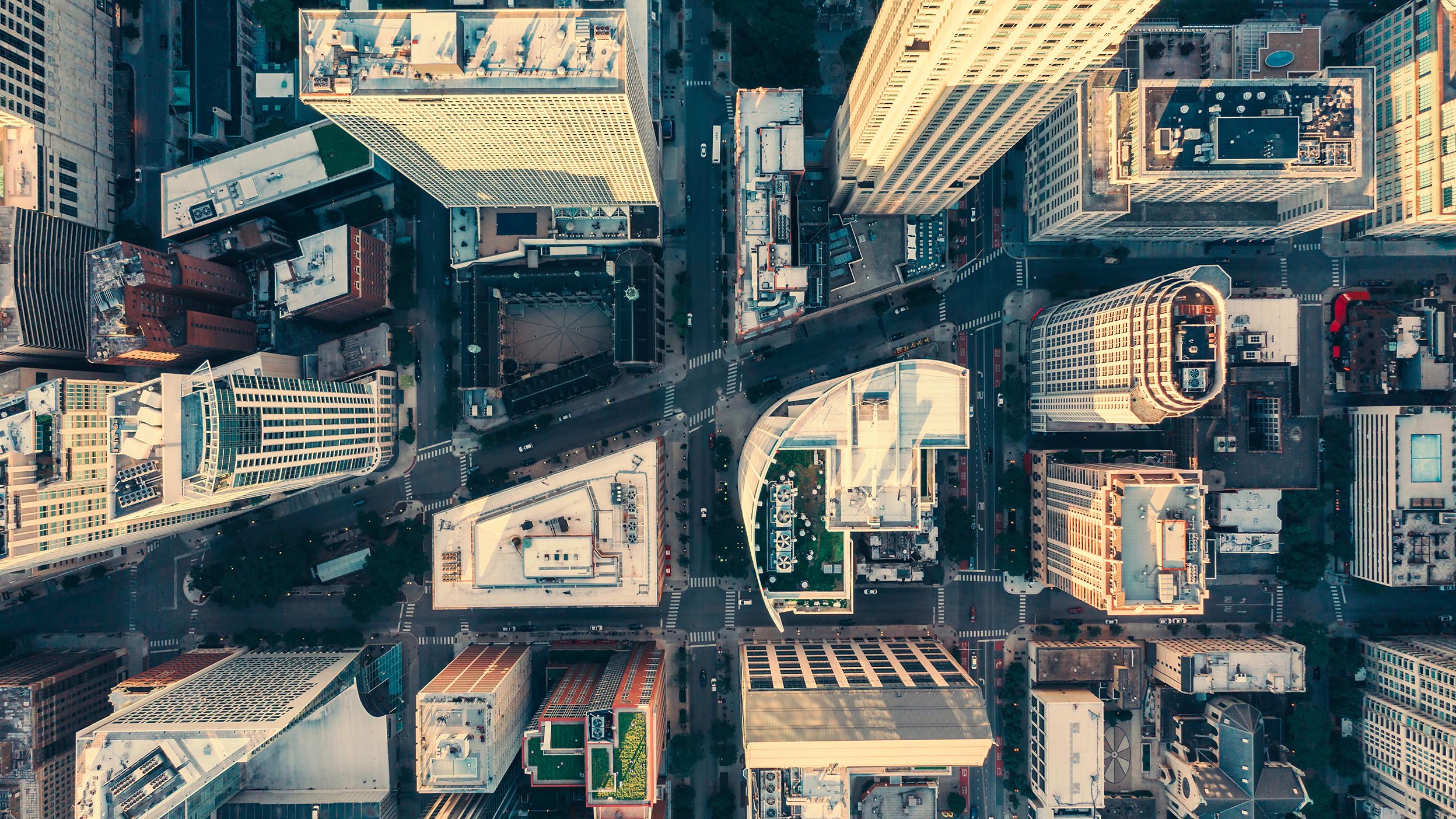 Top down aerial view of skyscrapers.