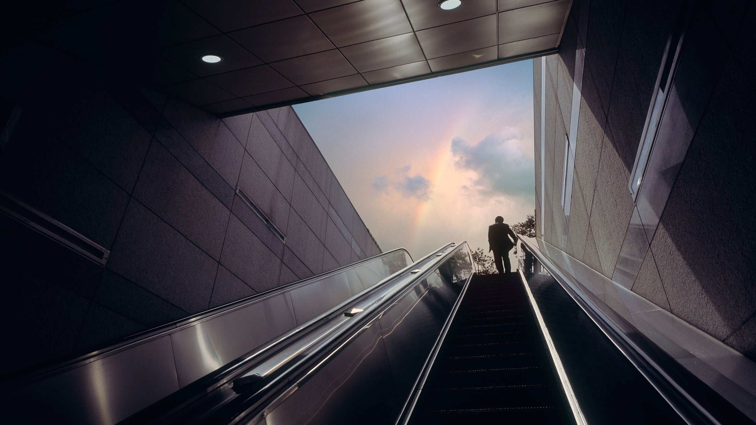 Person on escalator