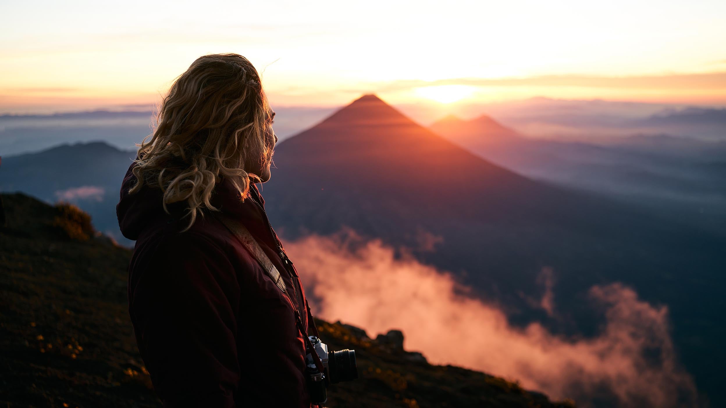 Woman staring into the mountains