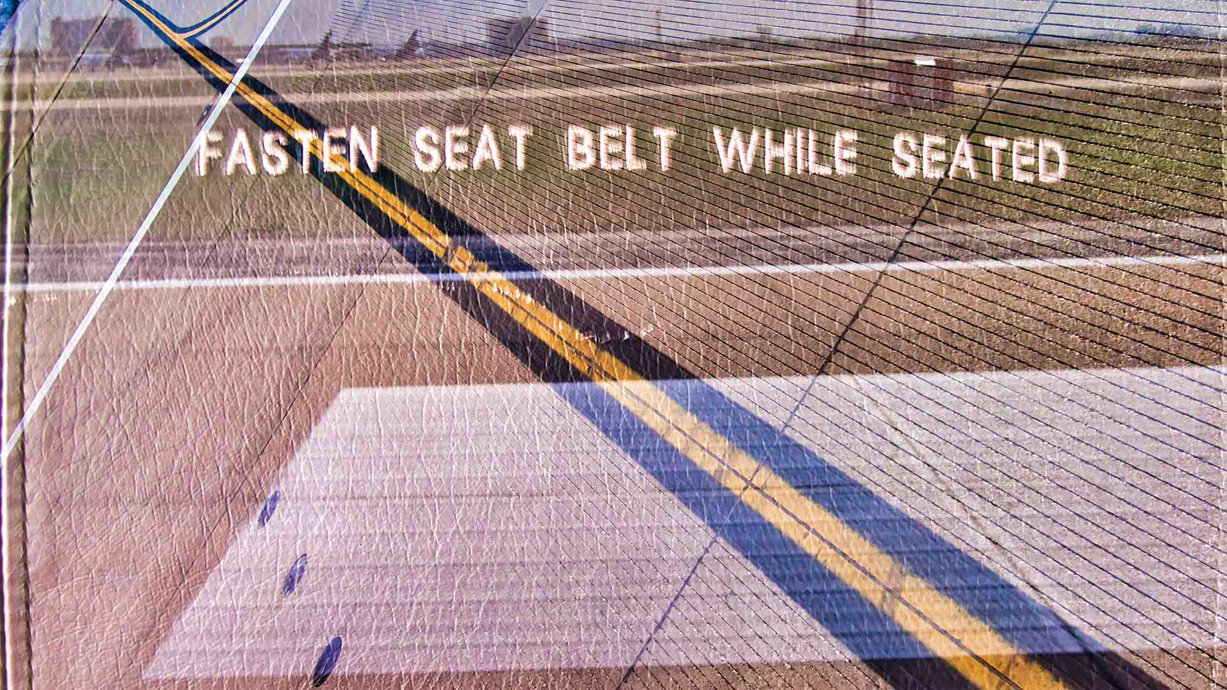 Message to fasten seat belt while seated