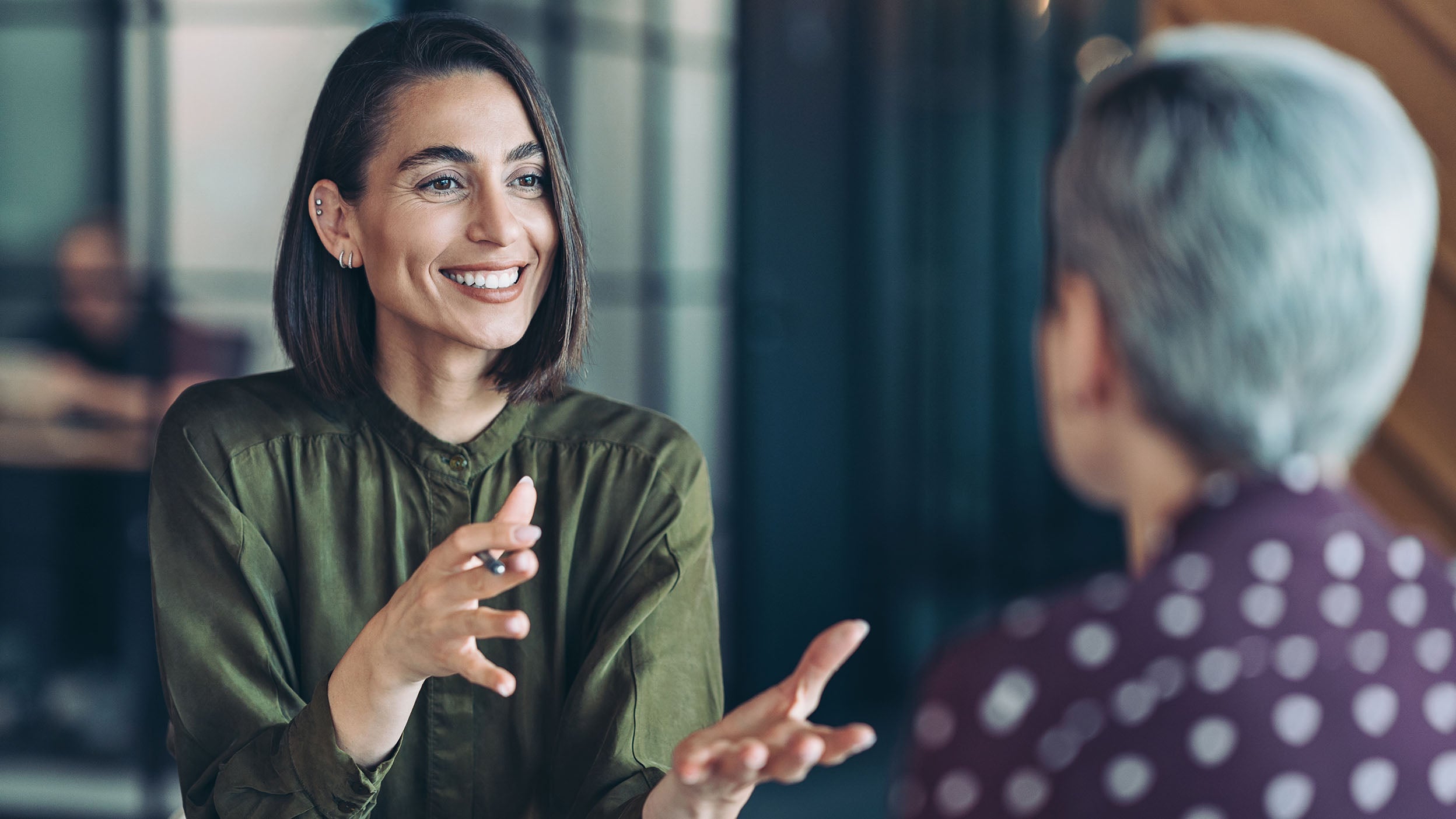 Two businesswomen talking in the office