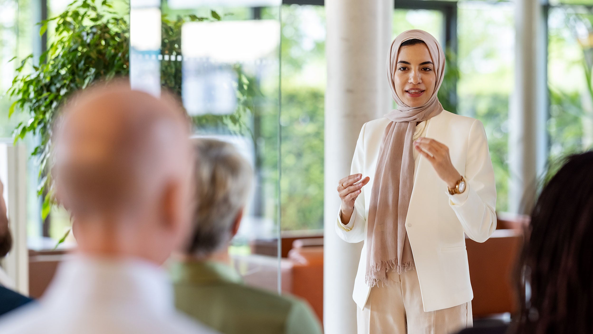 Muslim businesswoman addressing the audience in a conference 