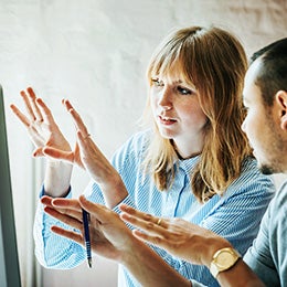 two people looking at a monitor