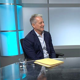 Two%20males%20sitting%20in%20a%20studio%20at%20a%20table%20in%20conversation%20with%20one%20another.%20There%20are%20notes%20on%20the%20table.