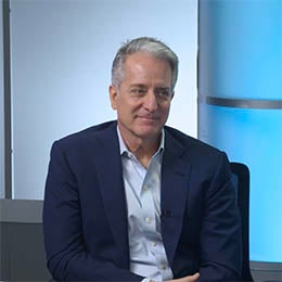 Two%20males%20sitting%20in%20a%20studio%20at%20a%20table%20in%20conversation%20with%20one%20another.%20There%20are%20notes%20on%20the%20table.