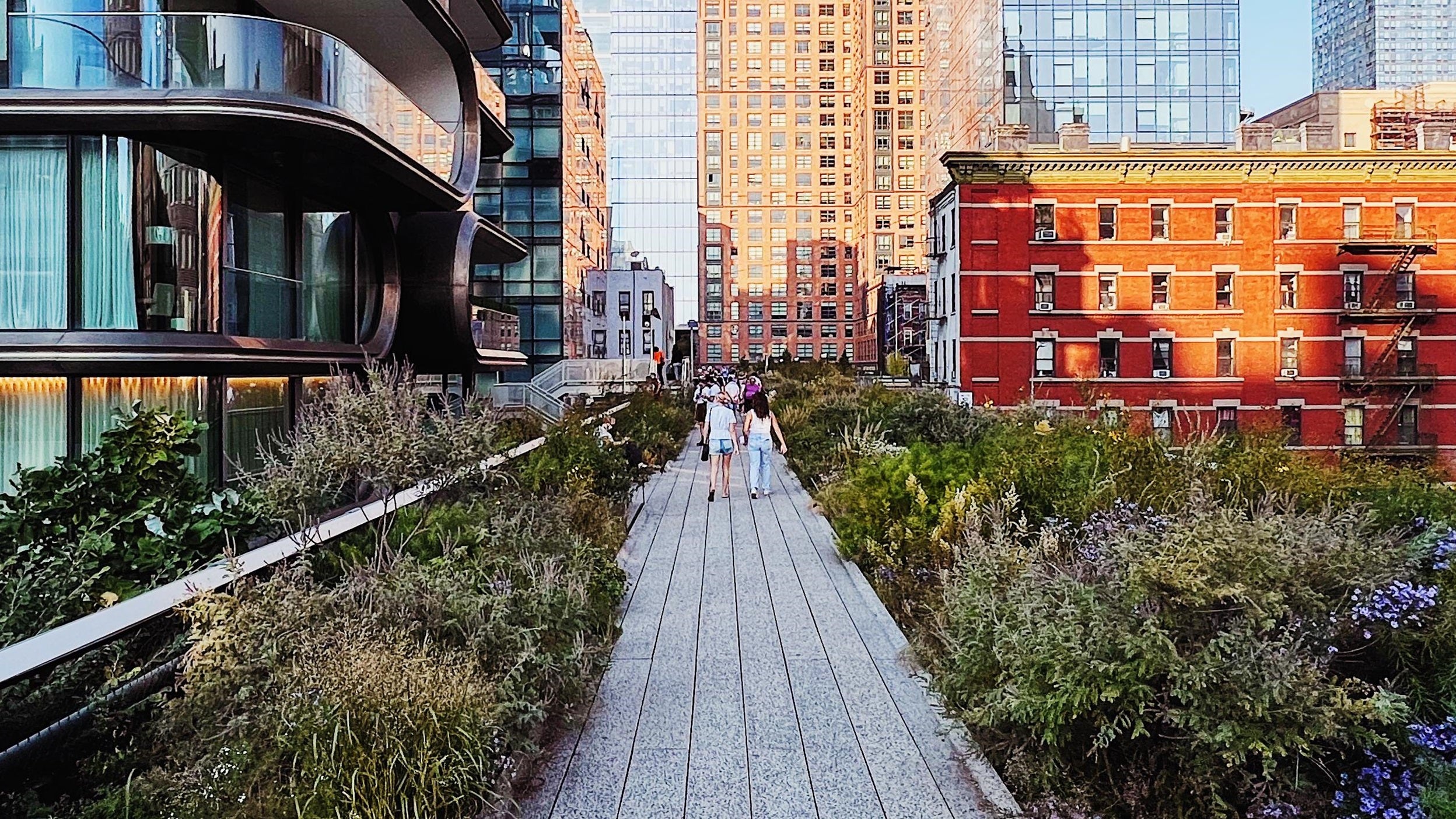People walking on the High Line path in New York City
